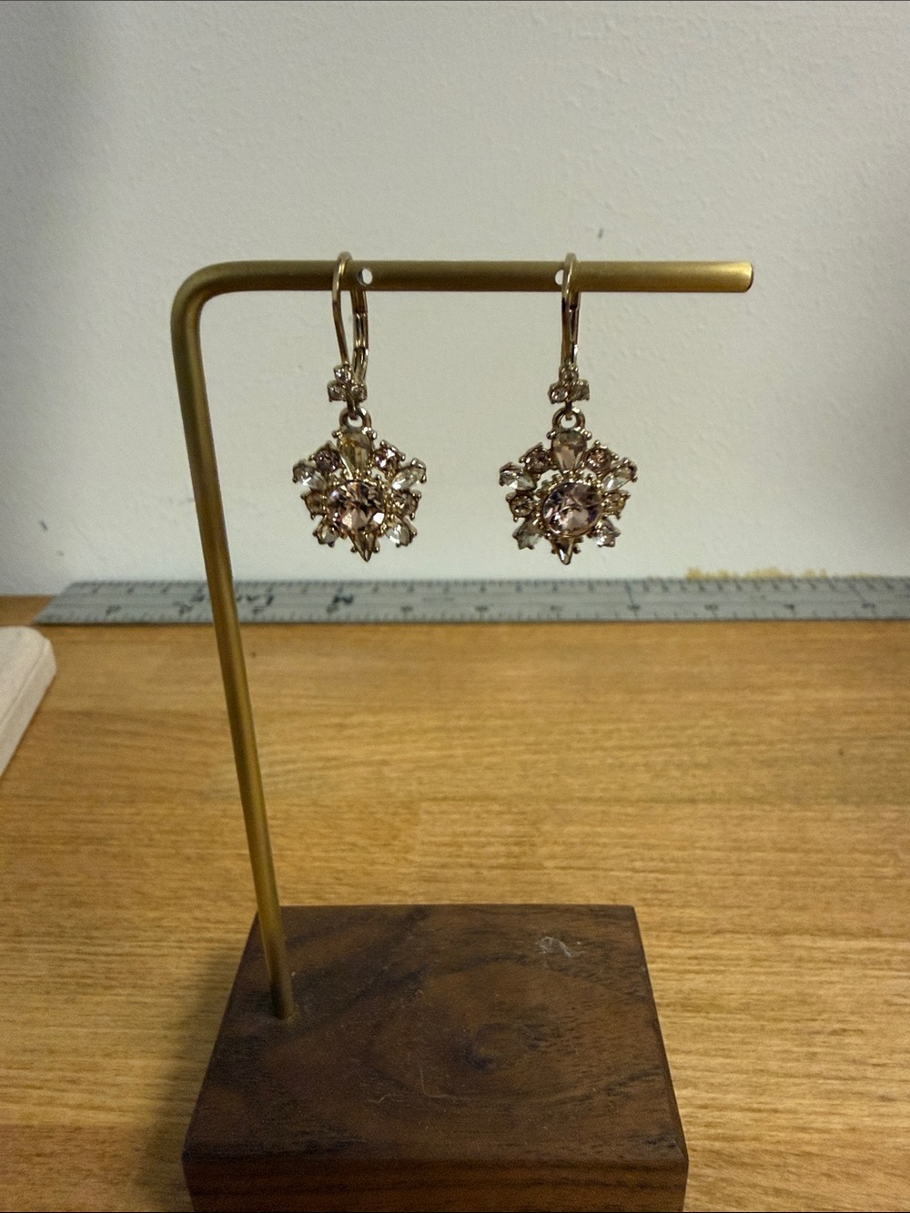 Gold tone earrings with crystal rhinestone sparkle design dangle